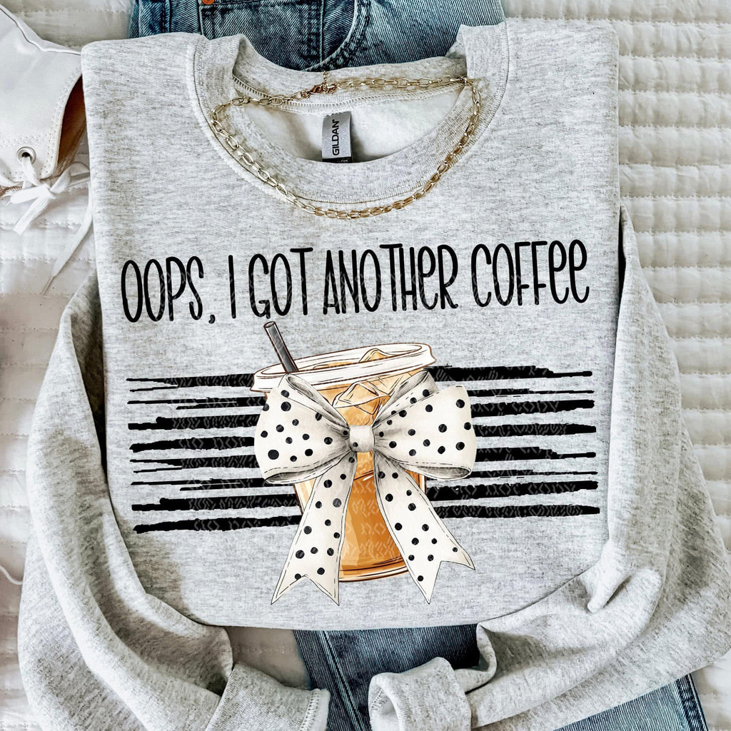 Gray sweatshirt with 'Oops, I got another coffee' text and coffee cup graphic.