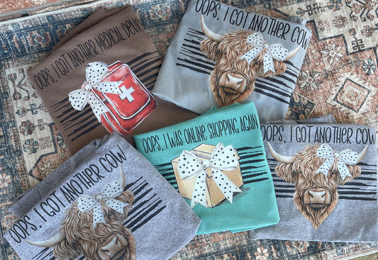 Four towels with cartoon cow designs and humorous text on a textured surface.