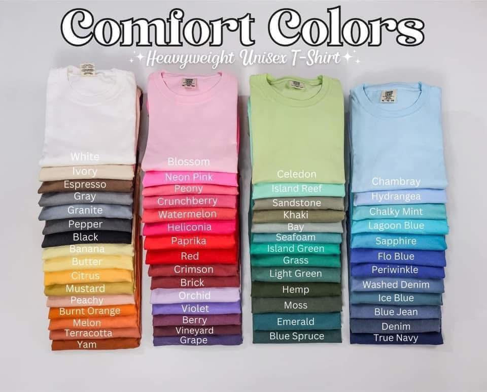 Collection of folded shirts in various colors with labels on a light gray background