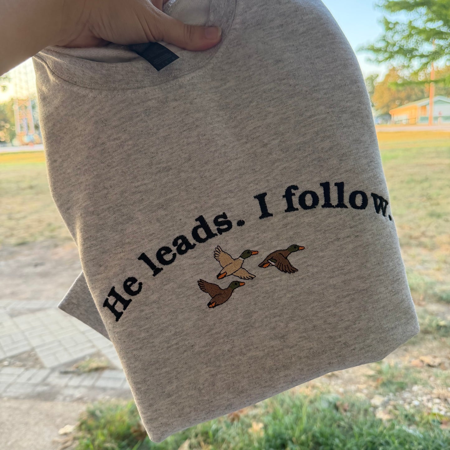 He Leads. I Follow. Embroidered Duck Sweatshirt