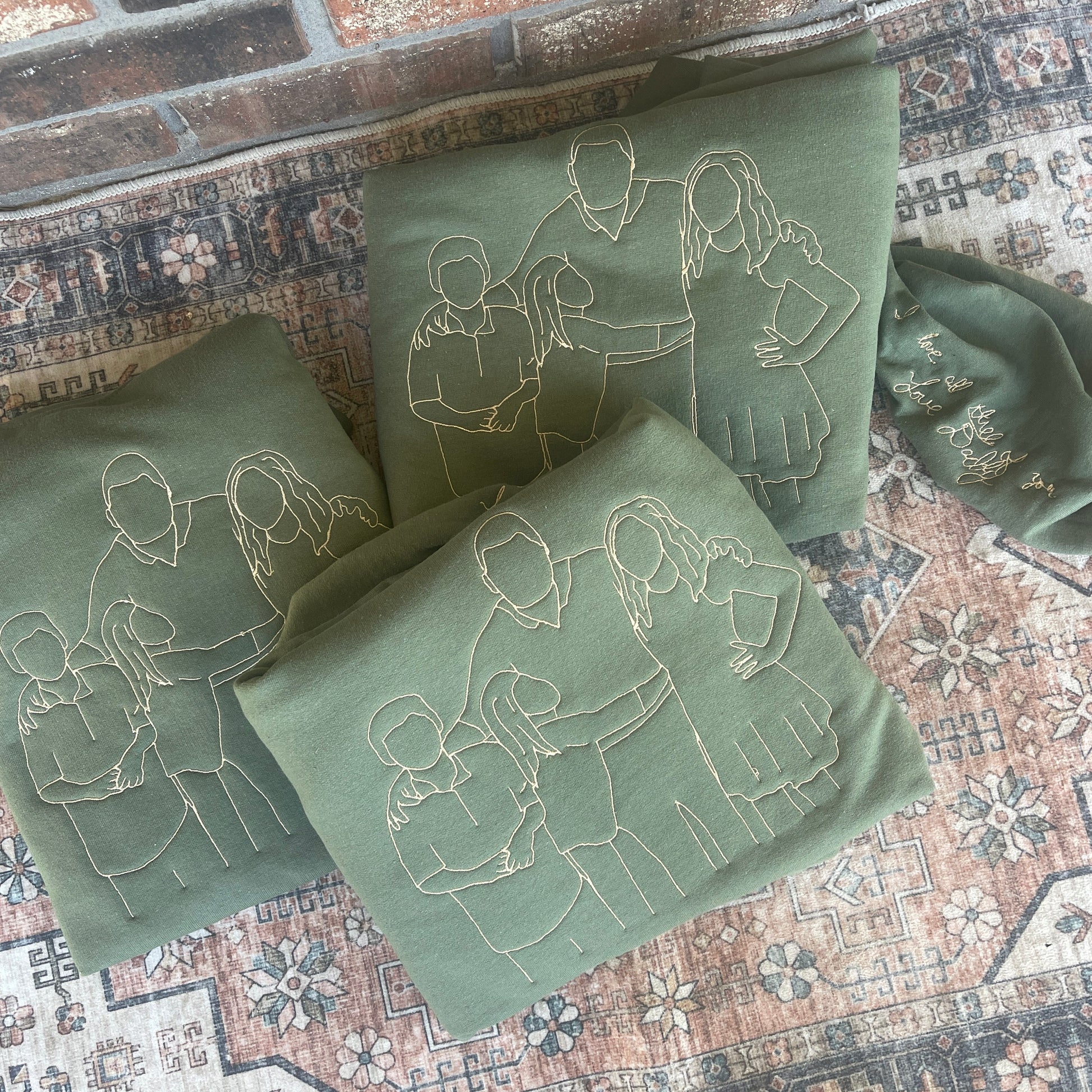 Green fabric with embroidered figures on a patterned surface
